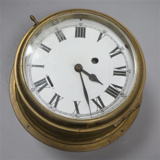 A brass bulkhead timepiece (later electric movement)